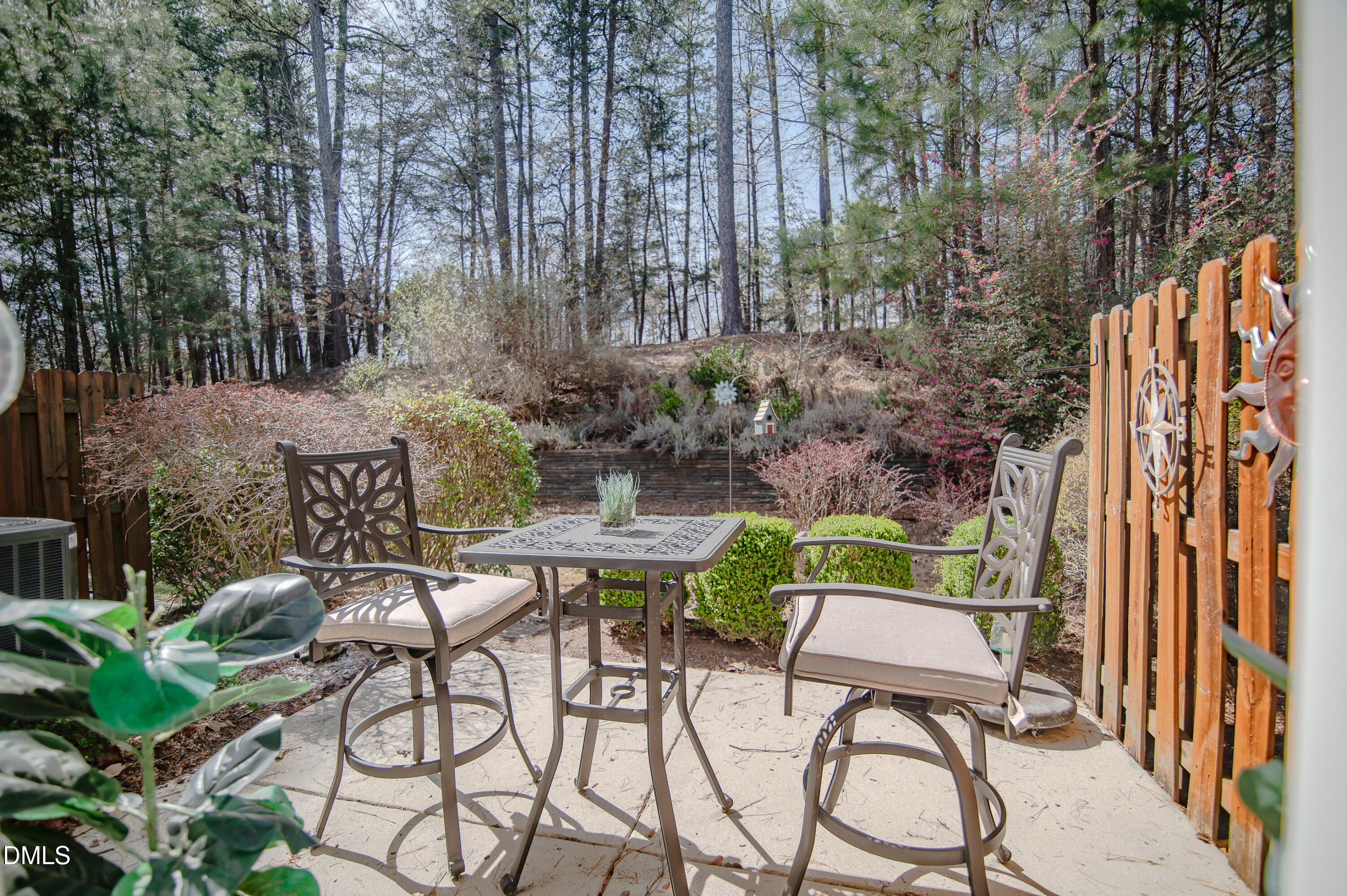 2933 Winding Waters Way Raleigh, NC 27614 - Photo 21 of 24 a view of patio with table and chairs and potted plants