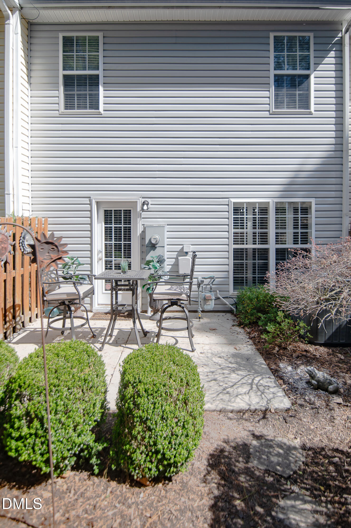 2933 Winding Waters Way Raleigh, NC 27614 - Photo 22 of 24 a view of a backyard with plants and chairs