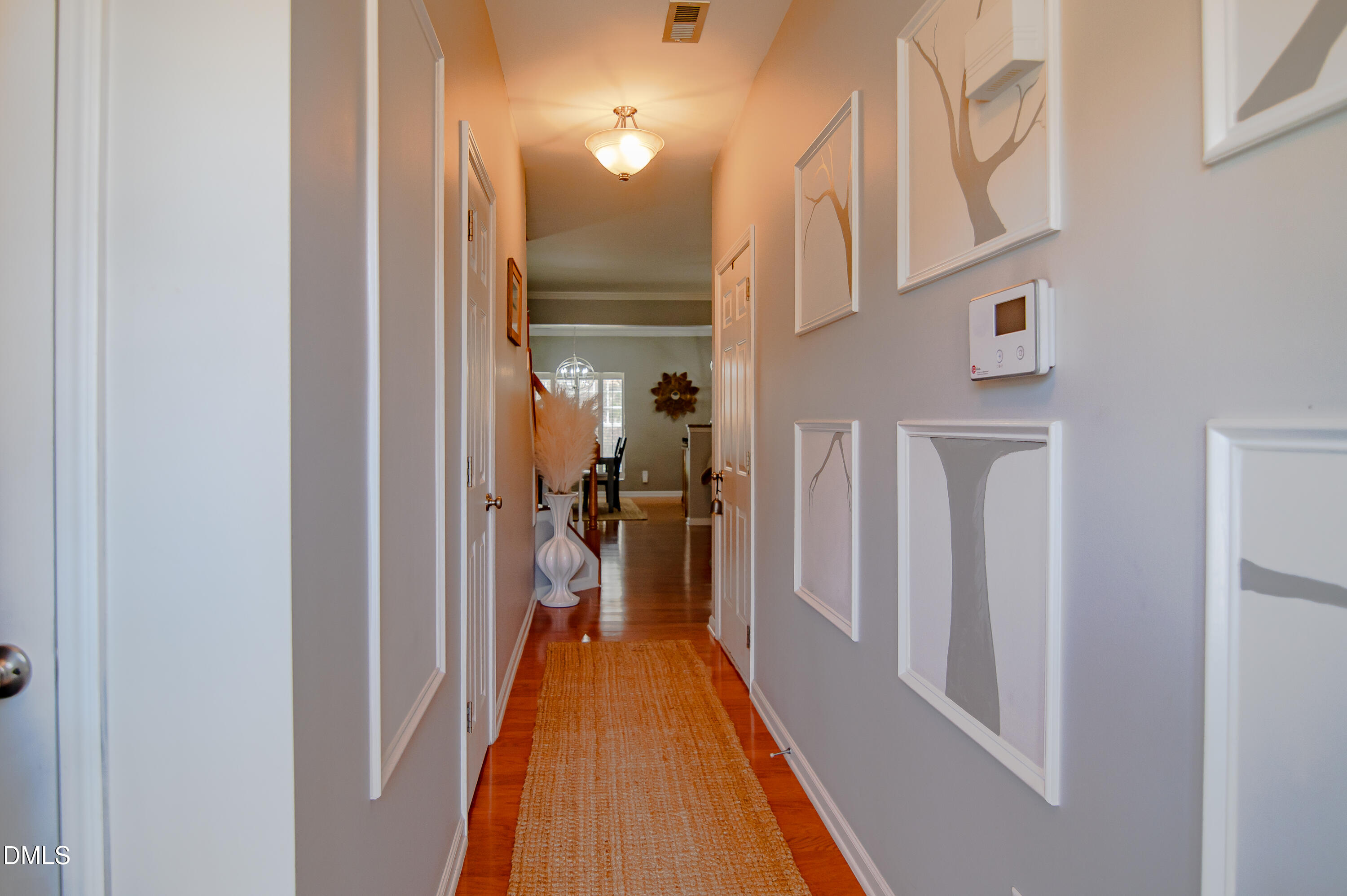 2933 Winding Waters Way Raleigh, NC 27614 - Photo 4 of 24 a view of a hallway with a white door and a glass door