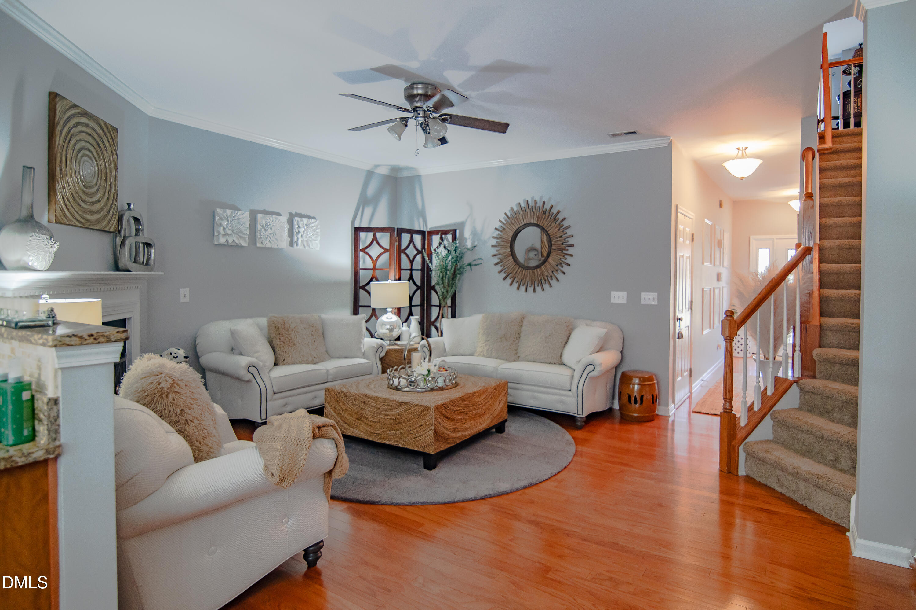 2933 Winding Waters Way Raleigh, NC 27614 - Photo 7 of 24 a living room with fireplace furniture and a wooden floor