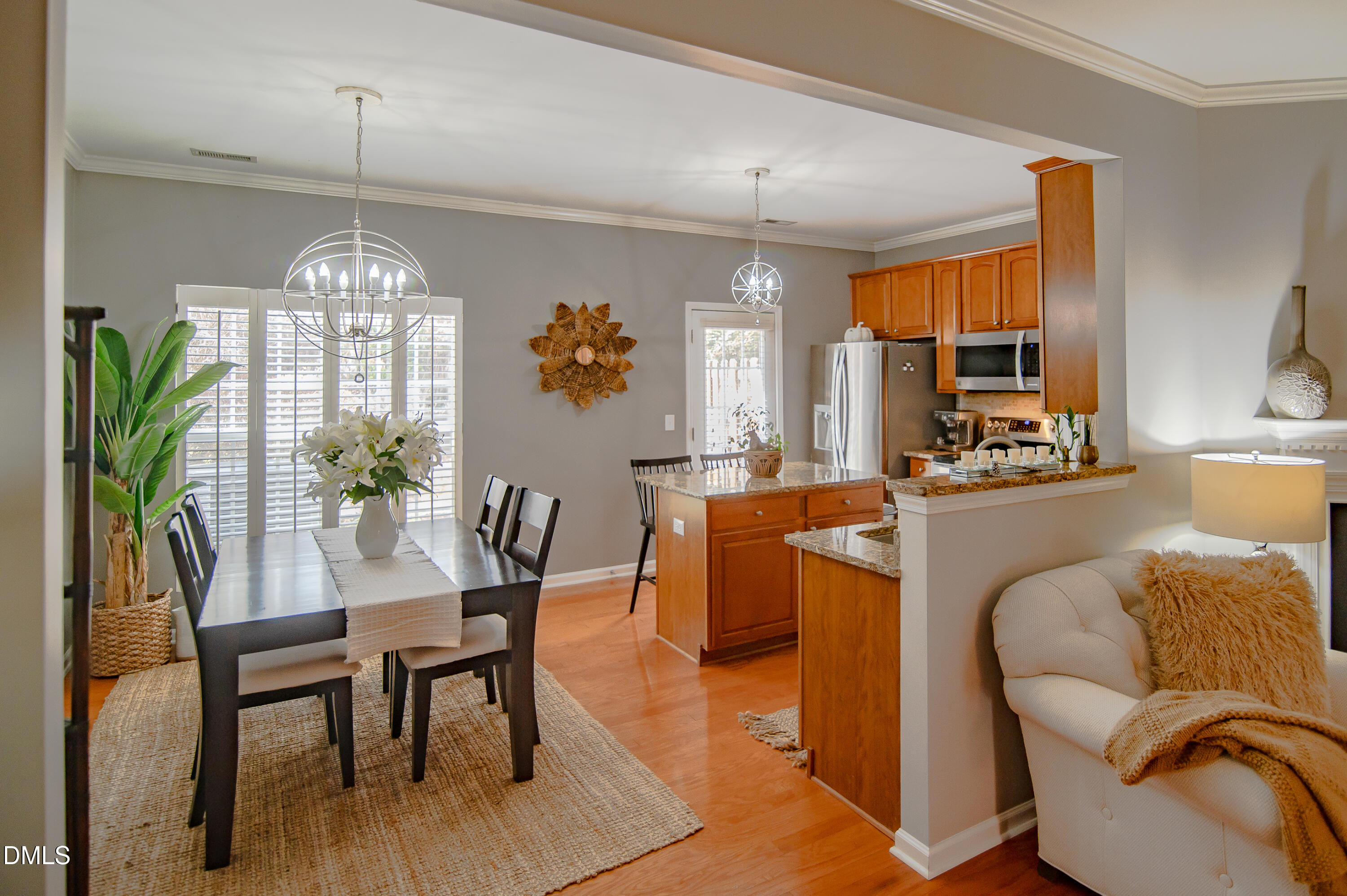 2933 Winding Waters Way Raleigh, NC 27614 - Photo 8 of 24 a dining room filled with furniture a livingroom and chandelier