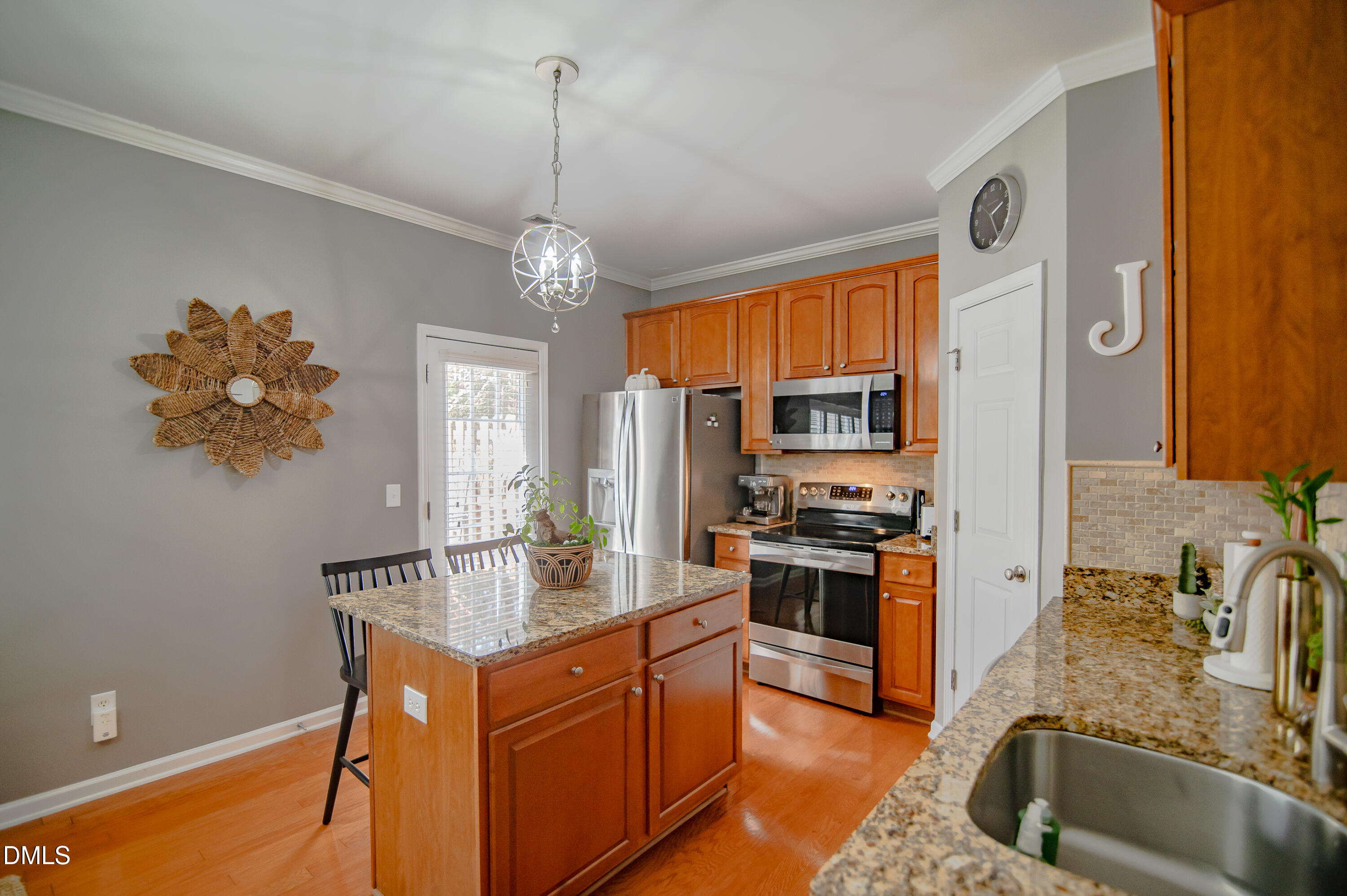 2933 Winding Waters Way Raleigh, NC 27614 - Photo 9 of 24 a kitchen with stainless steel appliances granite countertop a sink stove and refrigerator