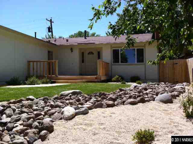 1455 Locksley Way Reno, NV 89503 - Photo 1 of 5 a front view of a house with a garden