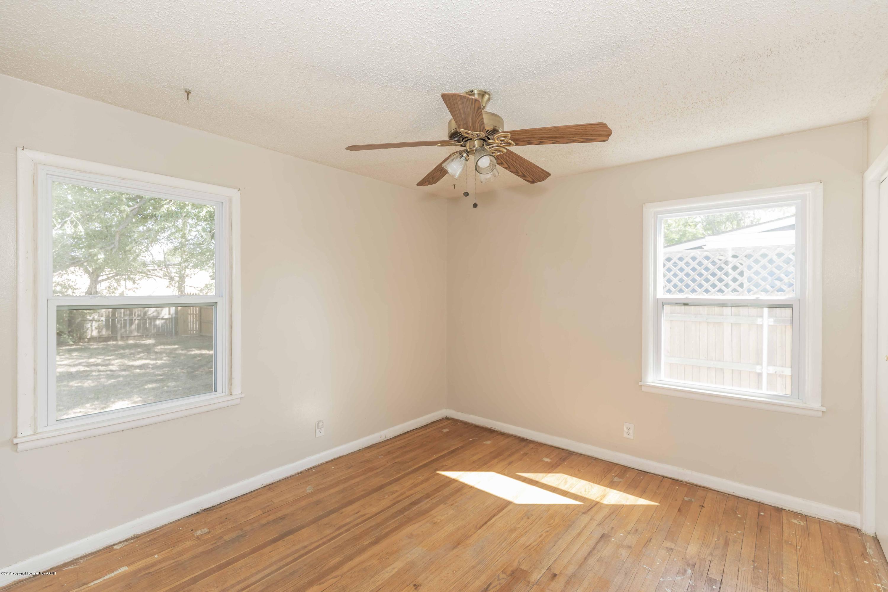3524 Lometa Drive Amarillo, TX 79109 - Photo 11 of 21 a view of a big room with wooden floor and windows