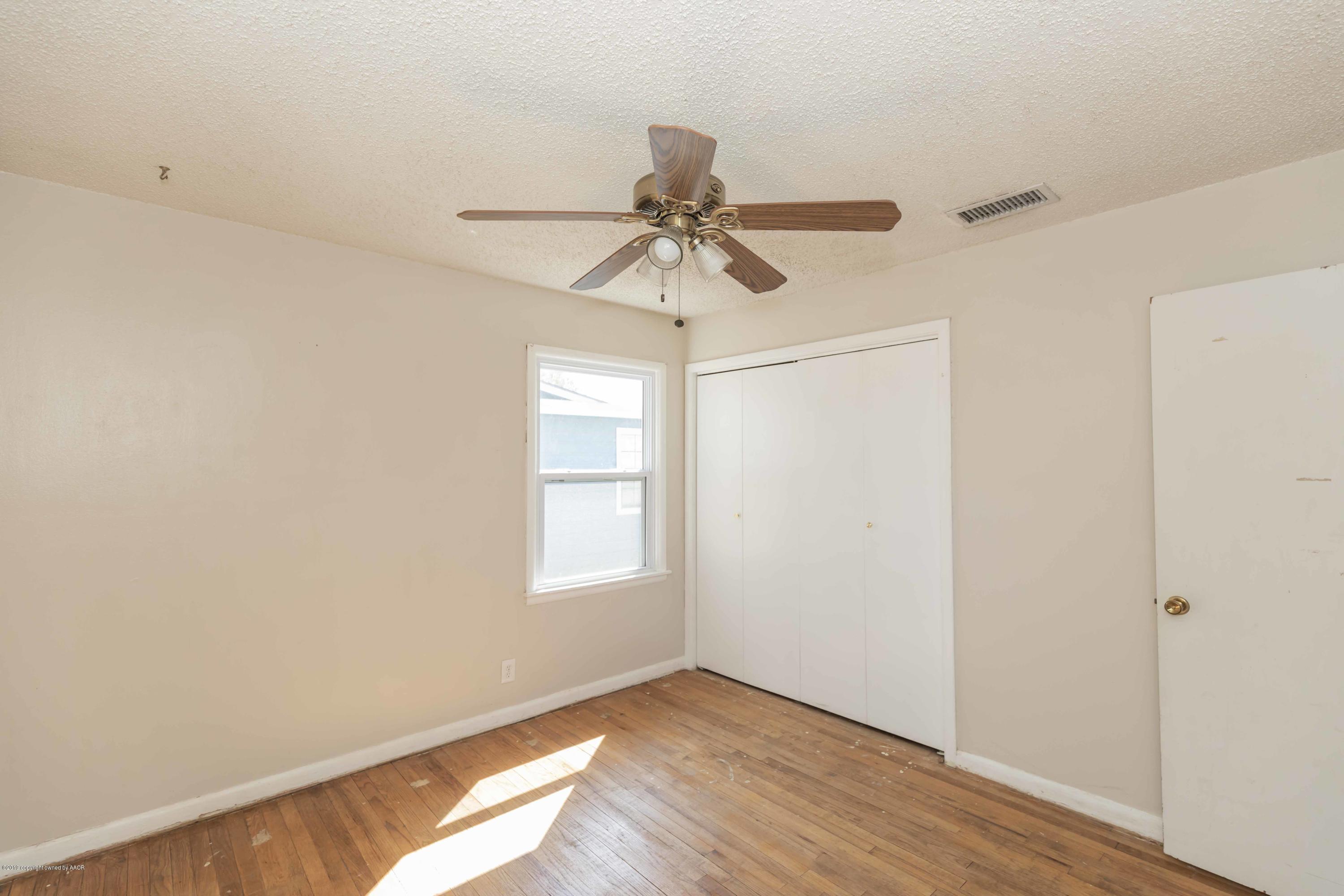 3524 Lometa Drive Amarillo, TX 79109 - Photo 12 of 21 a view of an empty room with window and wooden floor