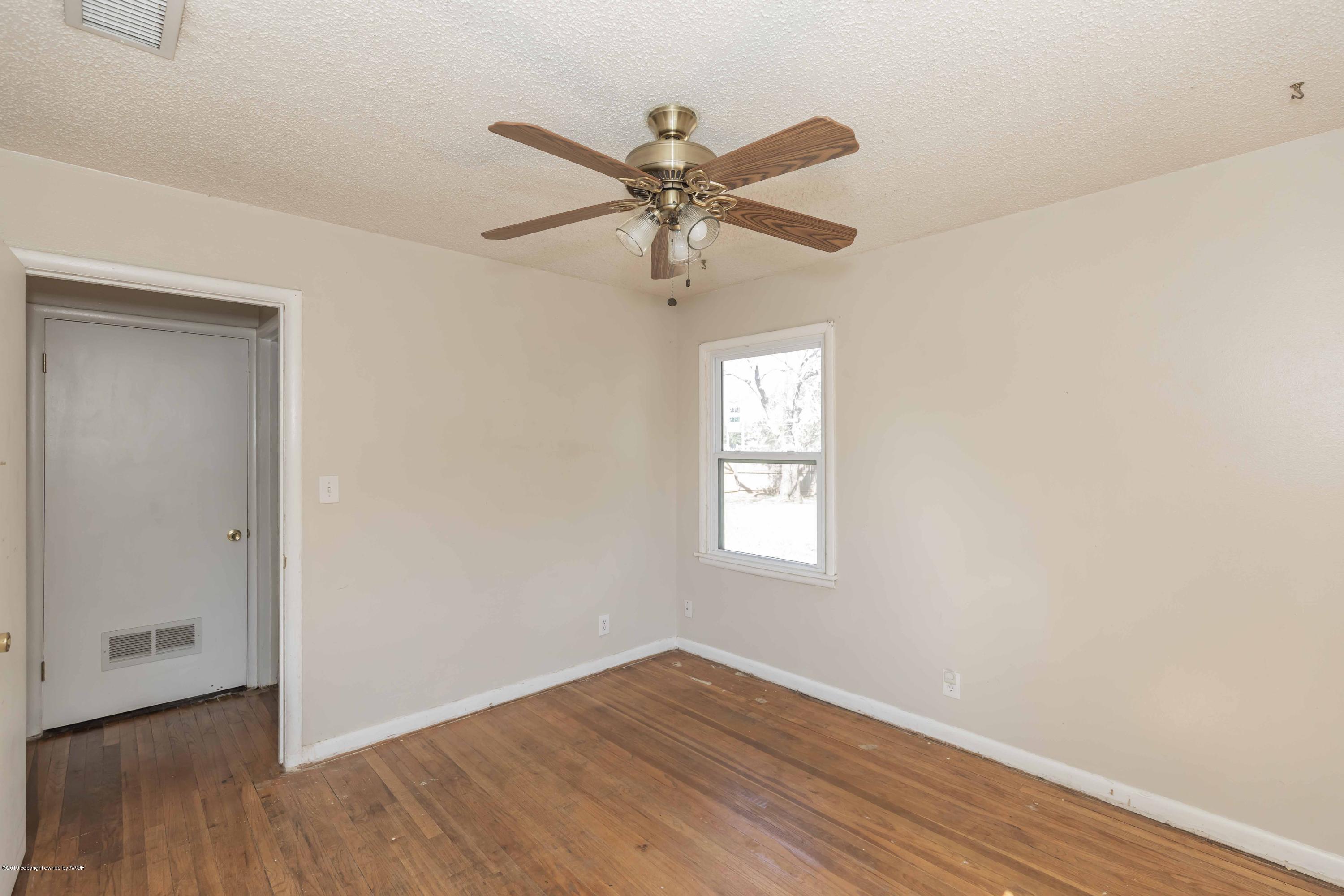 3524 Lometa Drive Amarillo, TX 79109 - Photo 14 of 21 a view of a livingroom with a window and wooden floor