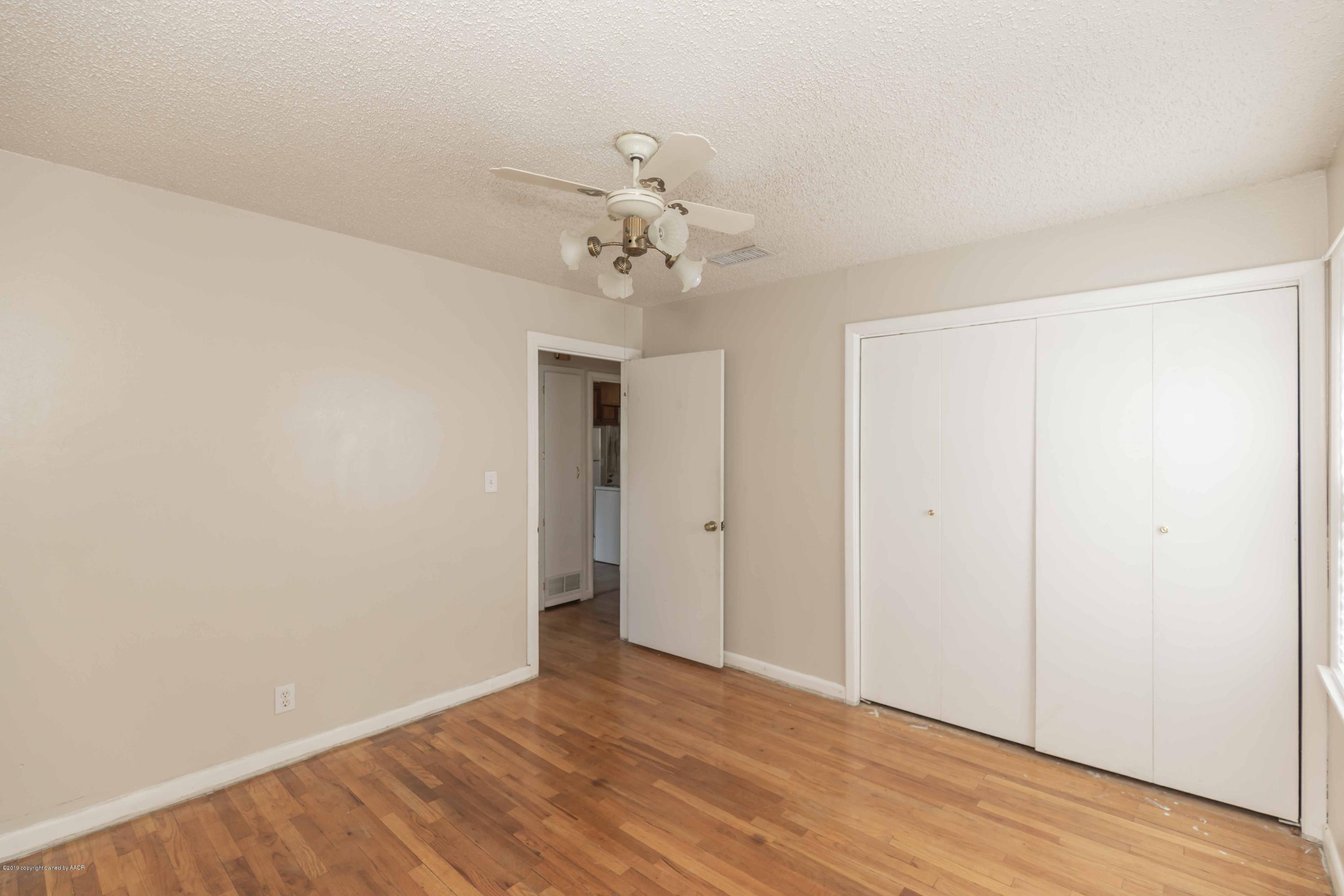 3524 Lometa Drive Amarillo, TX 79109 - Photo 17 of 21 a view of a room with wooden floor and ceiling fan