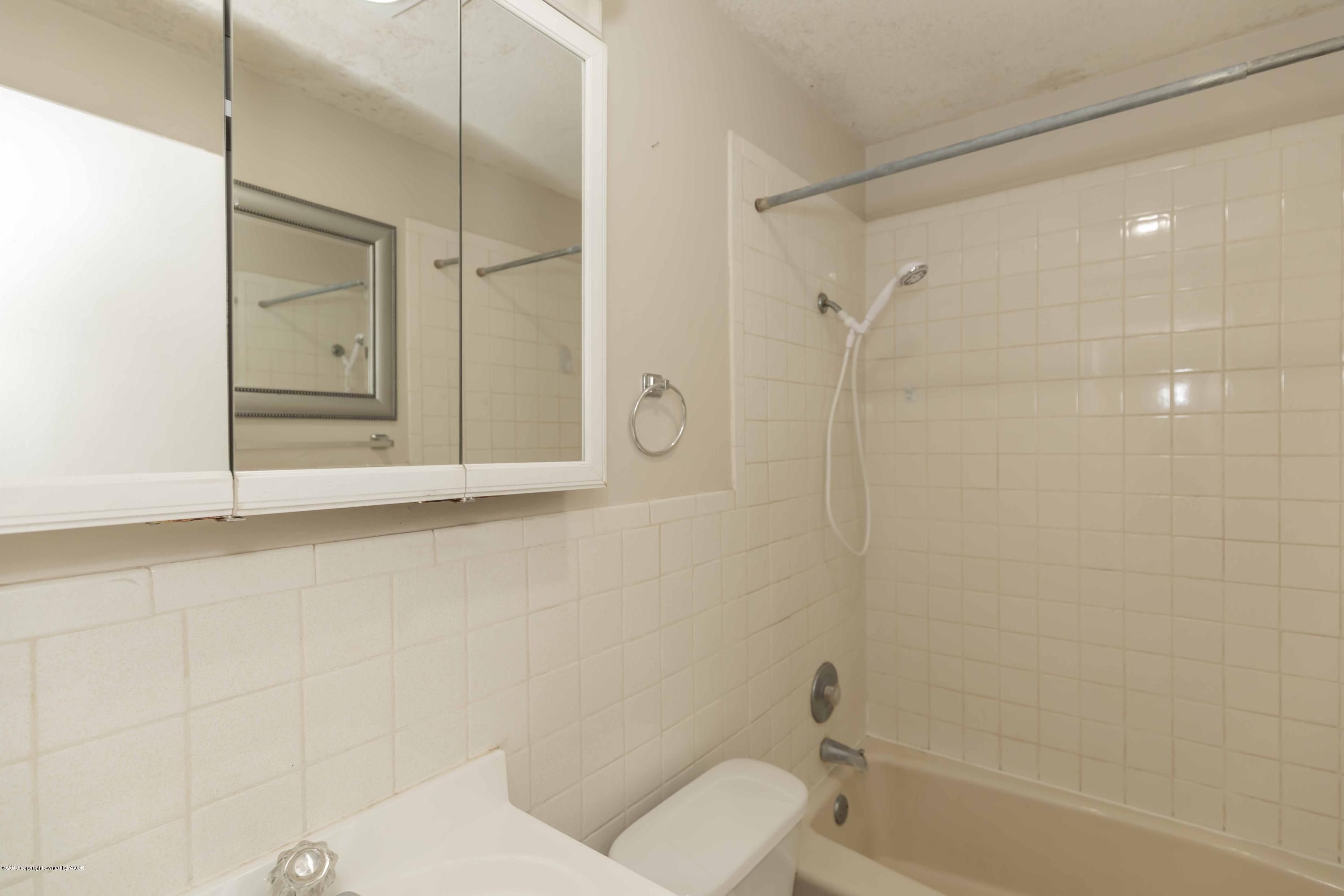 3524 Lometa Drive Amarillo, TX 79109 - Photo 19 of 21 a bathroom with a toilet and shower