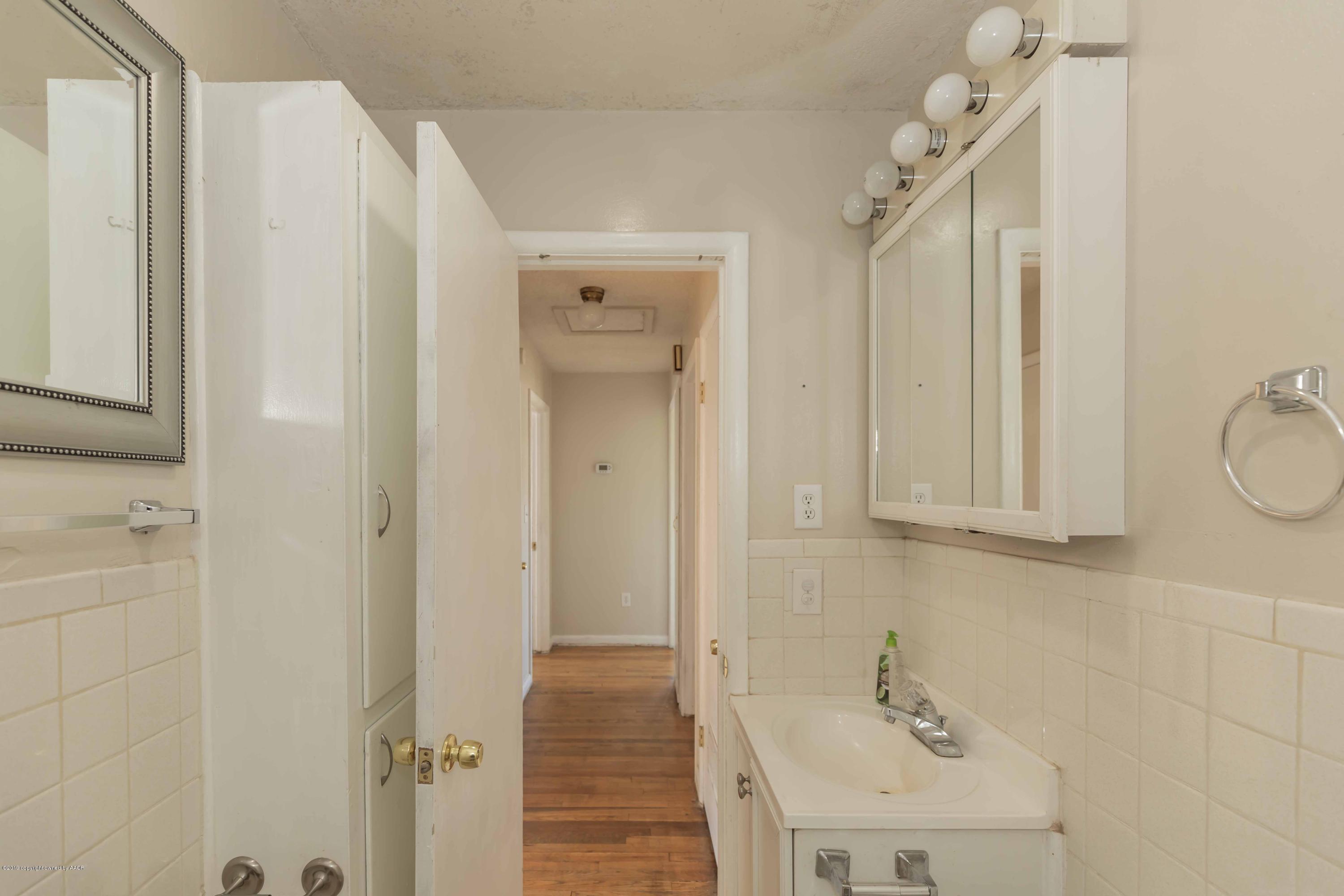 3524 Lometa Drive Amarillo, TX 79109 - Photo 20 of 21 a bathroom with a sink and mirror
