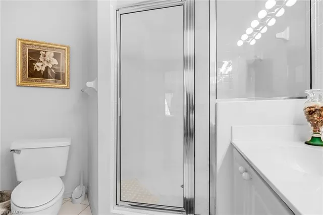 a bathroom with a toilet sink and shower