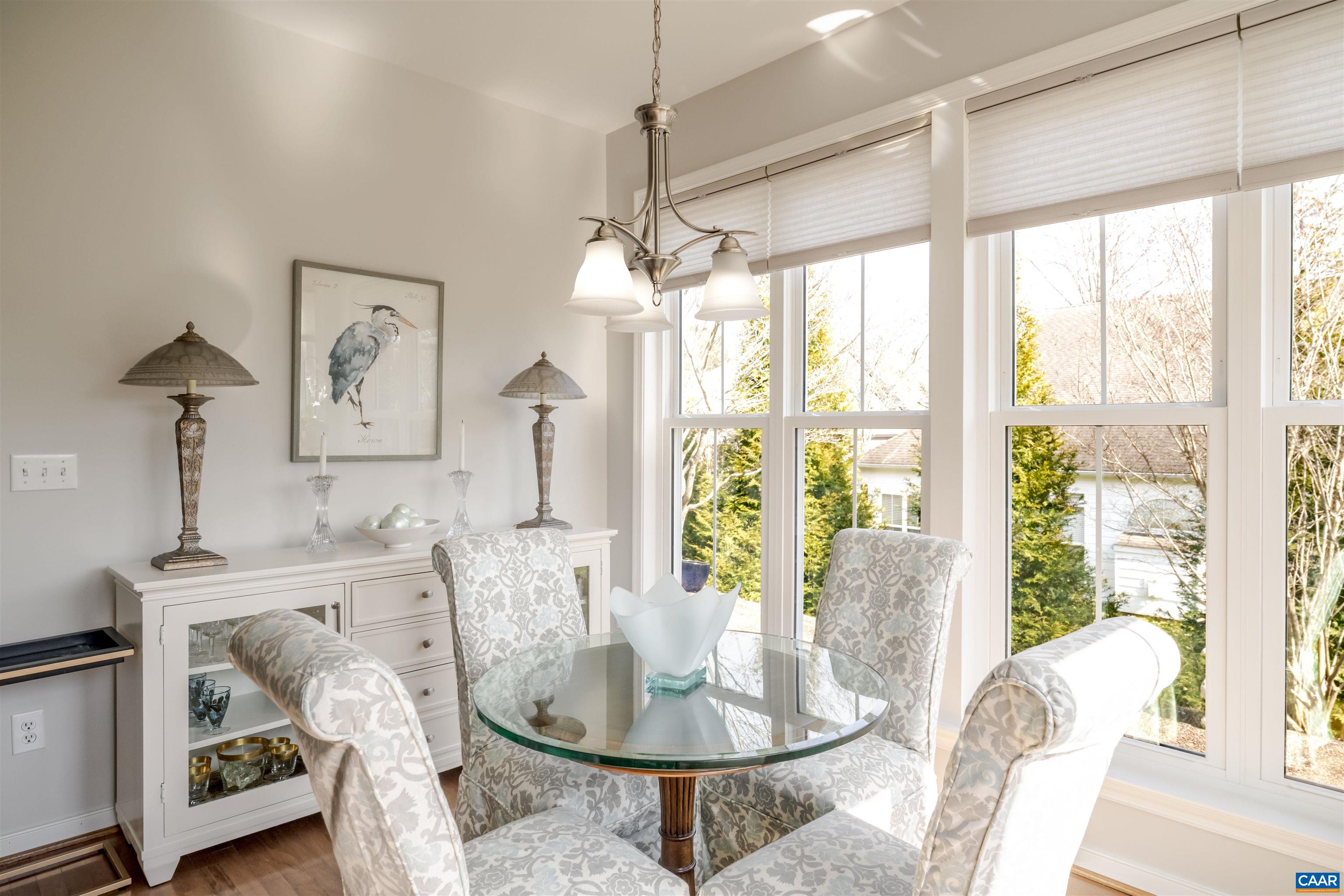 1322 Stonegate Court Crozet, VA 22932 - Photo 13 of 39 a dining room with furniture a chandelier and wooden floor