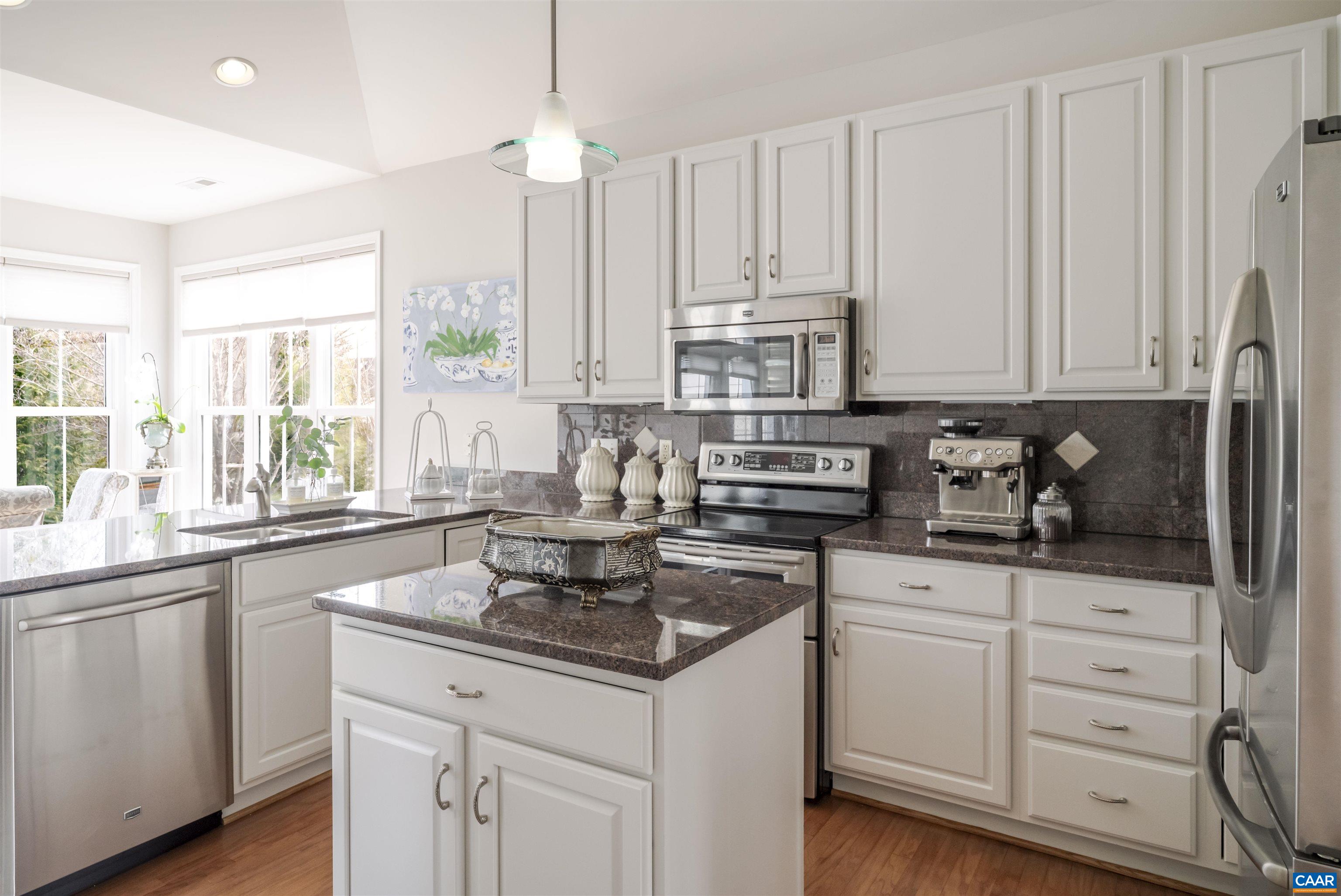 1322 Stonegate Court Crozet, VA 22932 - Photo 16 of 39 a kitchen with stainless steel appliances granite countertop a sink a stove and cabinets