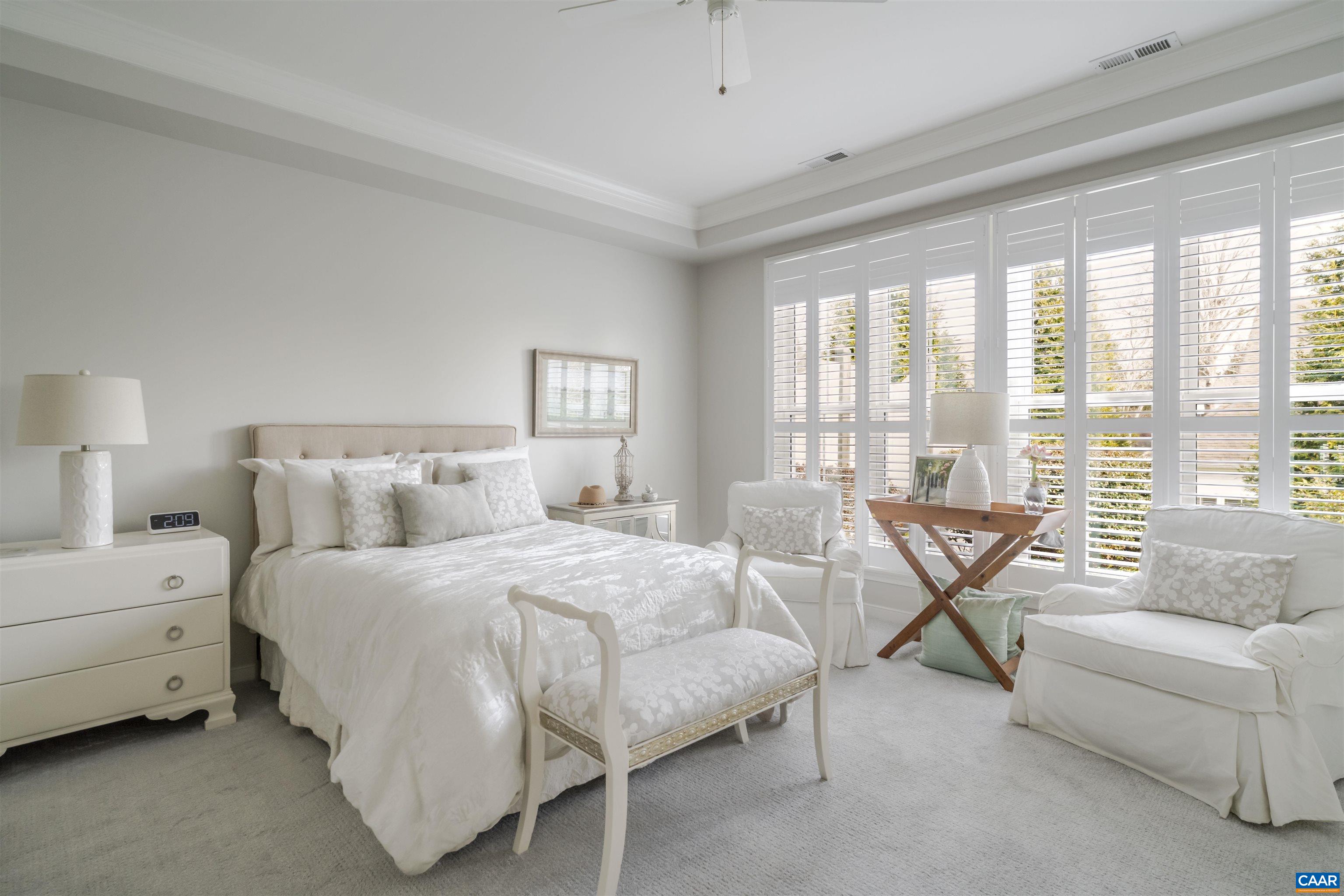 1322 Stonegate Court Crozet, VA 22932 - Photo 18 of 39 a spacious bedroom with a bed and a couch