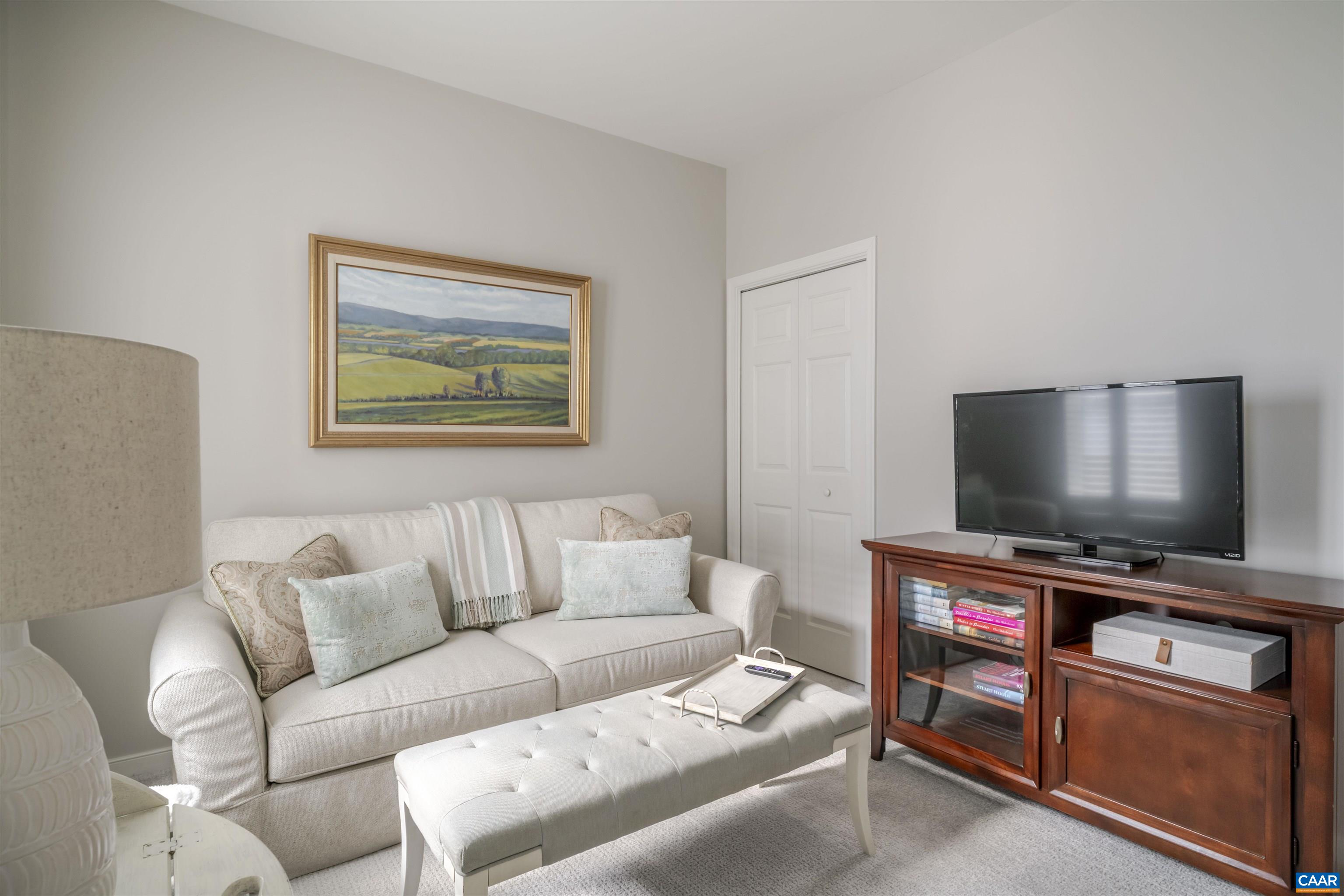 1322 Stonegate Court Crozet, VA 22932 - Photo 25 of 39 a living room with furniture and a flat screen tv