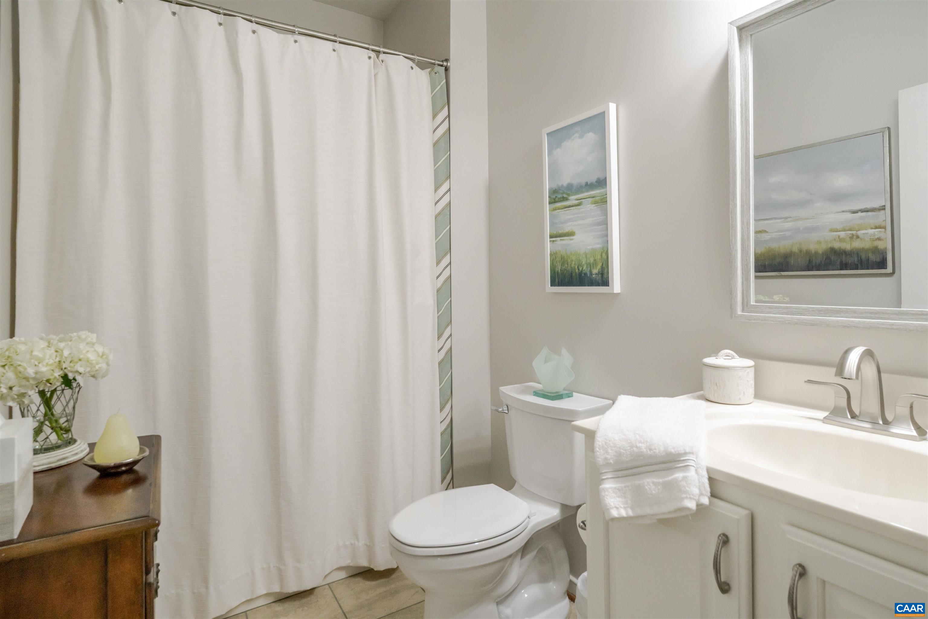 1322 Stonegate Court Crozet, VA 22932 - Photo 26 of 39 a bathroom with a granite countertop sink and a toilet