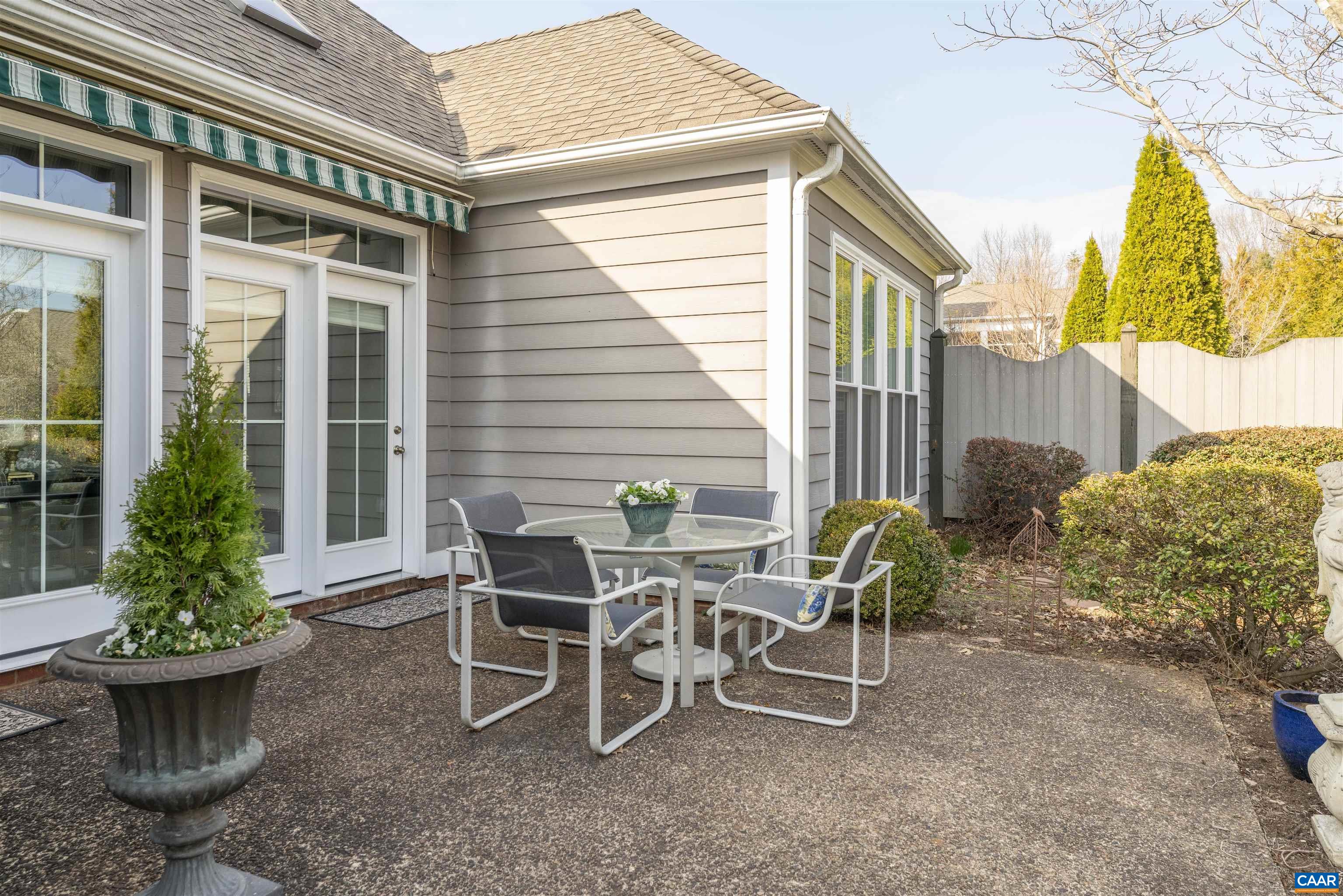 1322 Stonegate Court Crozet, VA 22932 - Photo 30 of 39 a view of a patio with table and chairs and potted plants