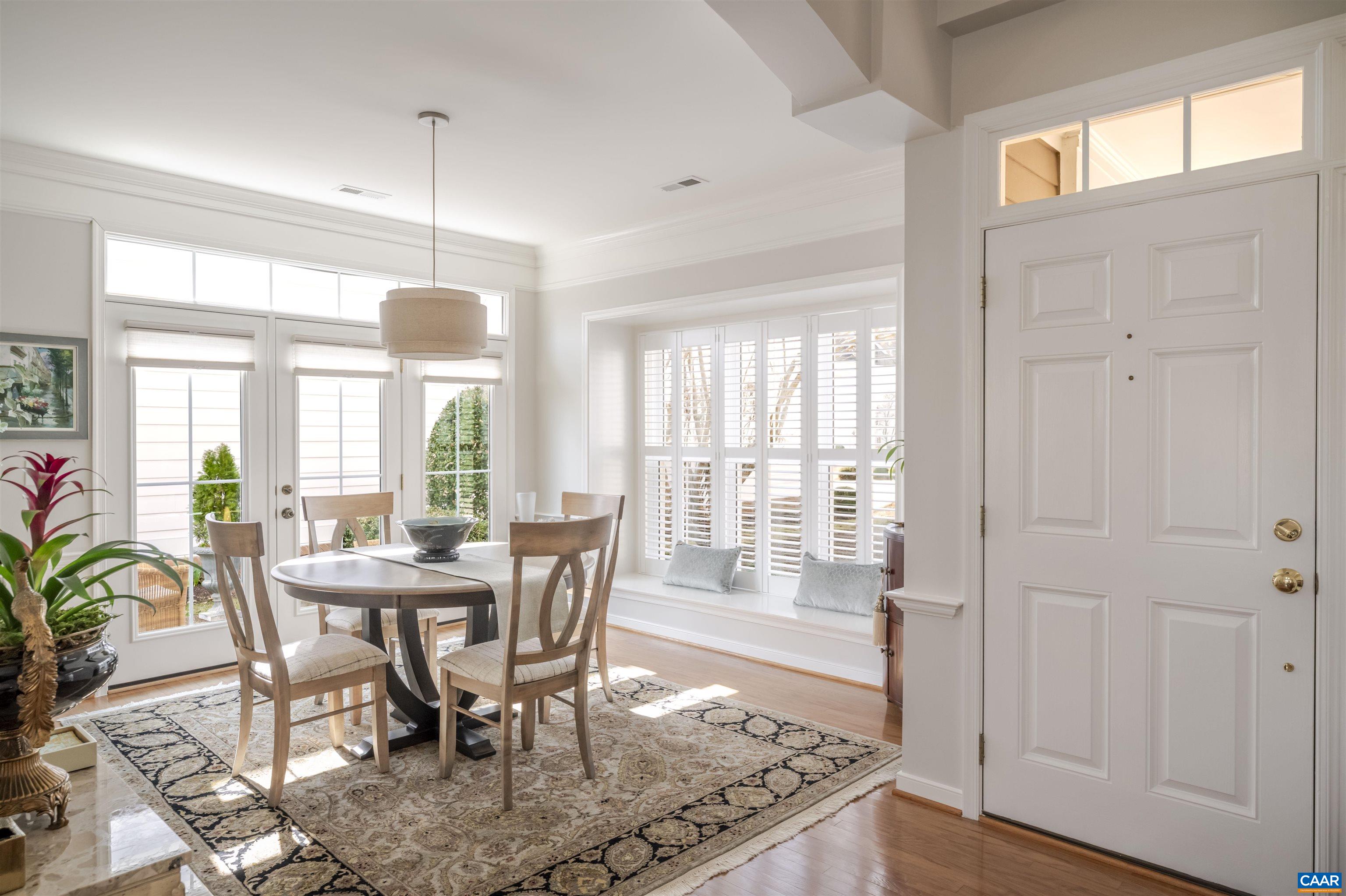 1322 Stonegate Court Crozet, VA 22932 - Photo 5 of 39 a view of a dining room with furniture window and wooden floor