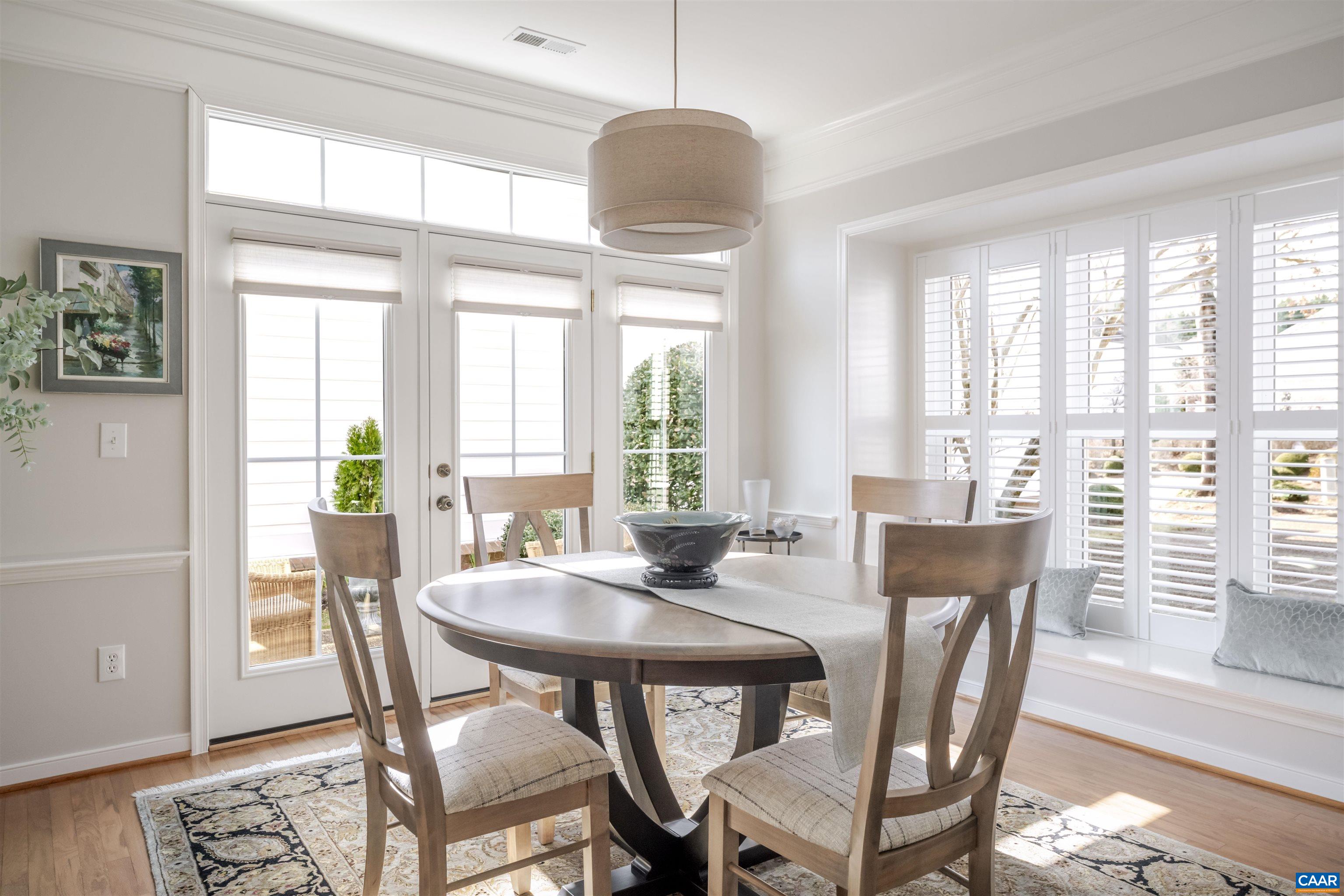 1322 Stonegate Court Crozet, VA 22932 - Photo 7 of 39 a view of a dining room with furniture window and wooden floor