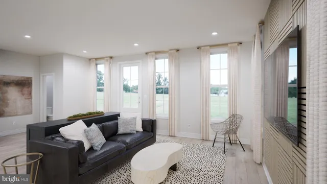 a living room with furniture and a rug