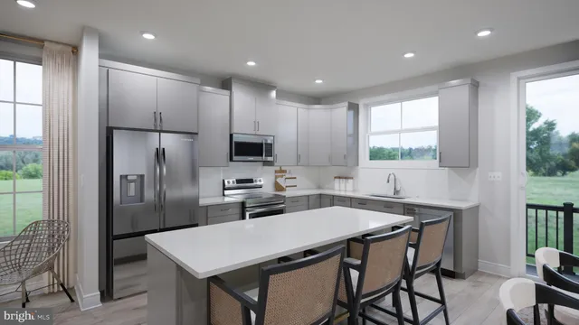 a kitchen with a table chairs refrigerator and window