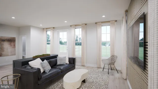 a living room with furniture and a rug