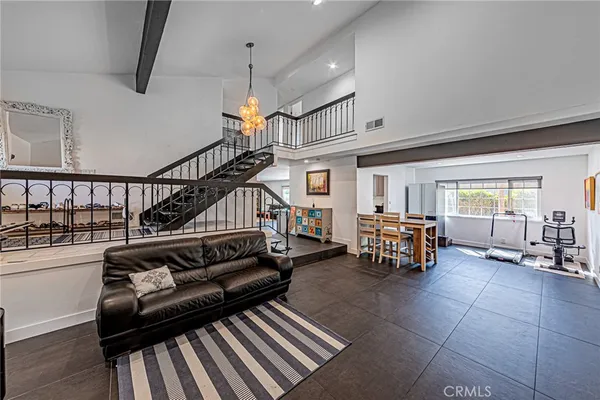 a view of a livingroom with furniture and lots of furniture