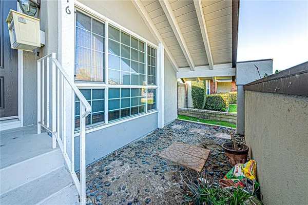 an aerial view of a house with an outdoor space