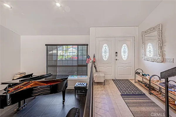 a view of a room with workspace and windows