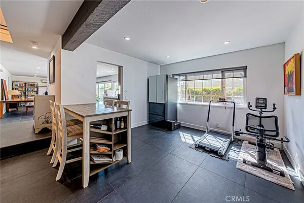 a kitchen with stainless steel appliances sink cabinets and window