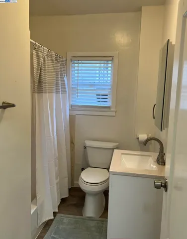 a bathroom with a toilet and a sink