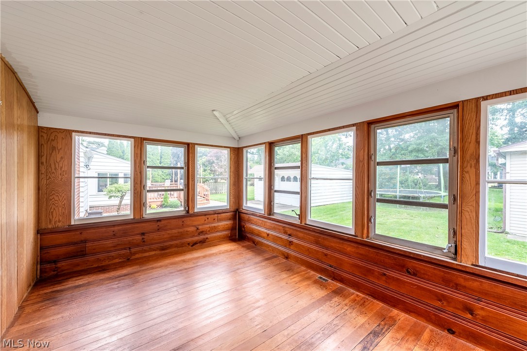21779 Eaton Road Cleveland, OH 44126 - Photo 16 of 46 Unfurnished sunroom with plenty of natural light, lofted ceiling, and wooden ceiling