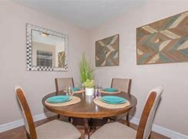 420 Garland Drive, Unit 1005 Lake Jackson, TX 77566 - Photo 5 of 9 a view of a dining room with furniture