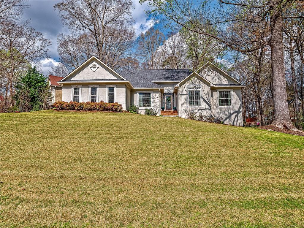 2122 Line Tree Lane Powder Springs, GA 30127 - Photo 1 of 1 a front view of a house with yard and green space