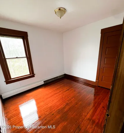 a bathroom with a sink toilet and mirror