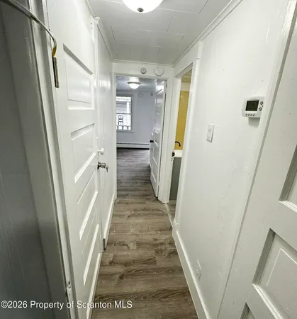 a bathroom with a sink a toilet and a shower