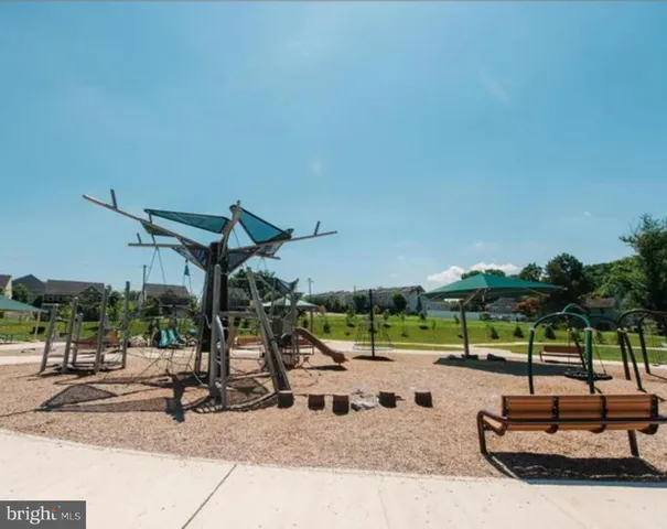 a picture of a bench in front of a wall