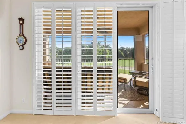 a bathroom with a double vanity sink mirror and bathtub