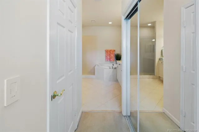 a bathroom with a shower sink and mirror