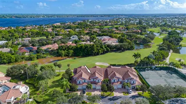 an aerial view of a house with a garden