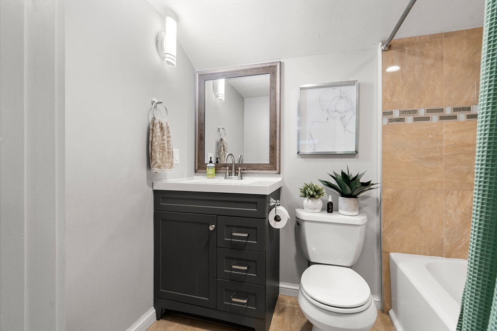 7 Indian Neck Road Wareham, MA 02571 - Photo 30 of 34 a bathroom with a toilet a sink a tub and mirror