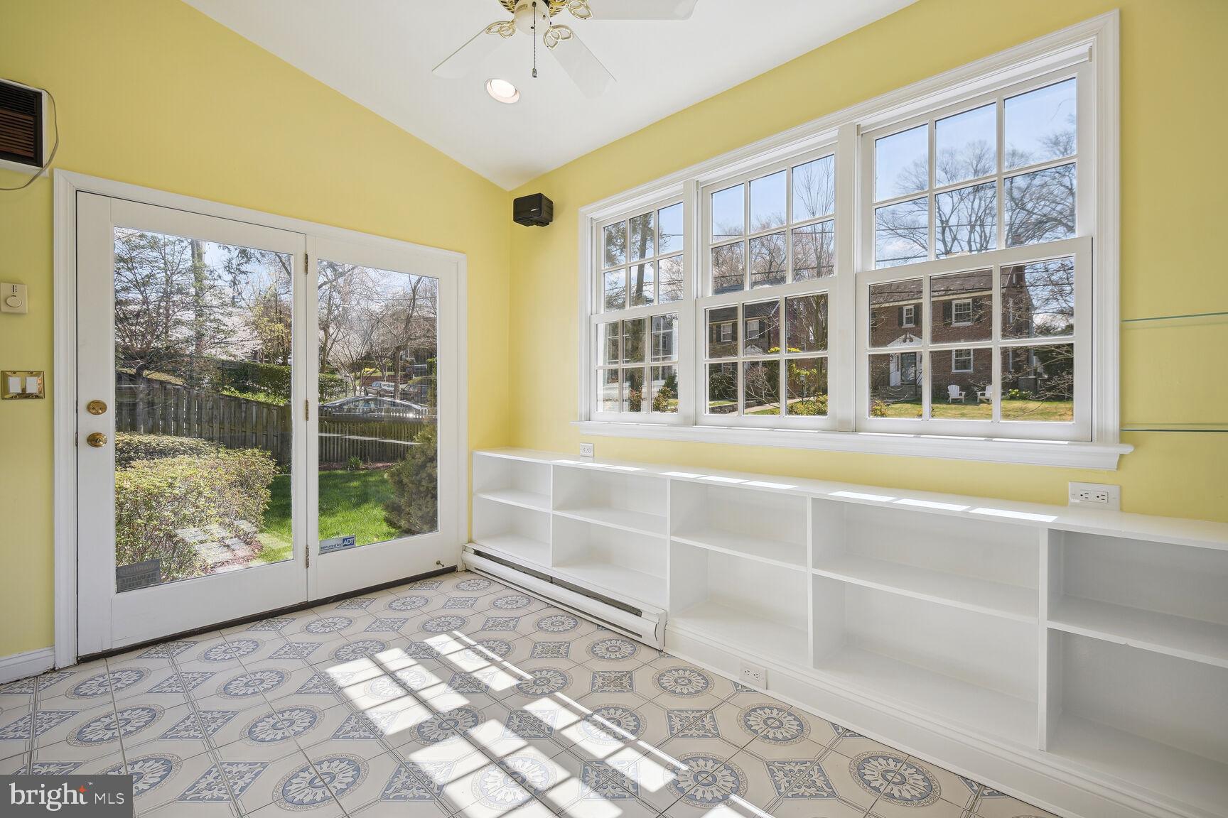 7501 Glendale Road Chevy Chase, MD 20815 - Photo 15 of 43 Sunroom with built-in bookshelves