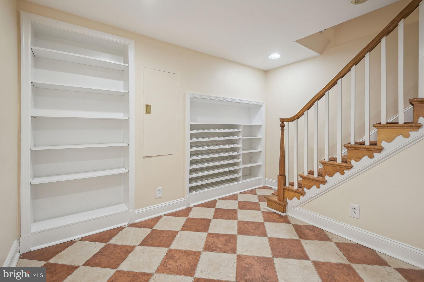 7501 Glendale Road Chevy Chase, MD 20815 - Photo 28 of 43 Lower Level Landing with bookshelves