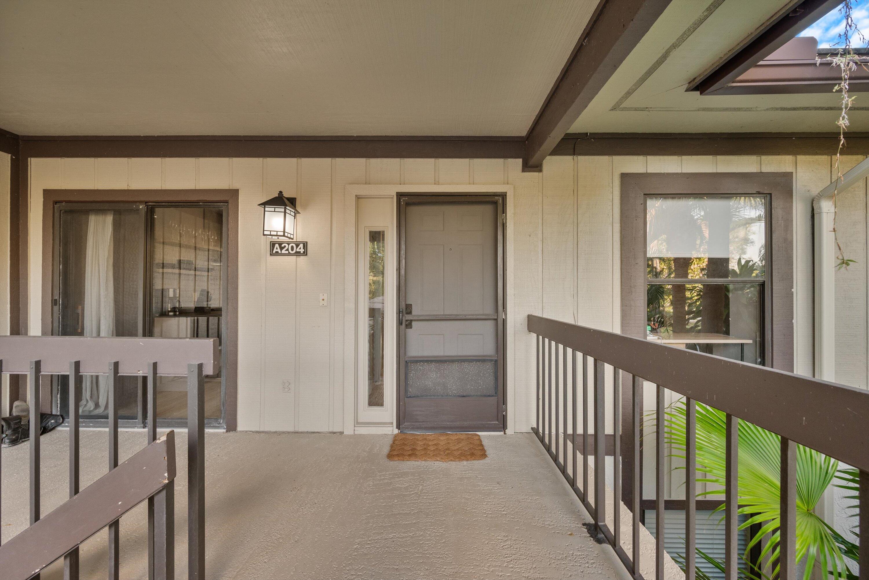 13224 Polo Club Road, Unit A204 Wellington, FL 33414 - Photo 1 of 27 a view of a porch of a house