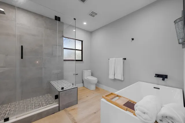 a bathroom with a bathtub sink and toilet