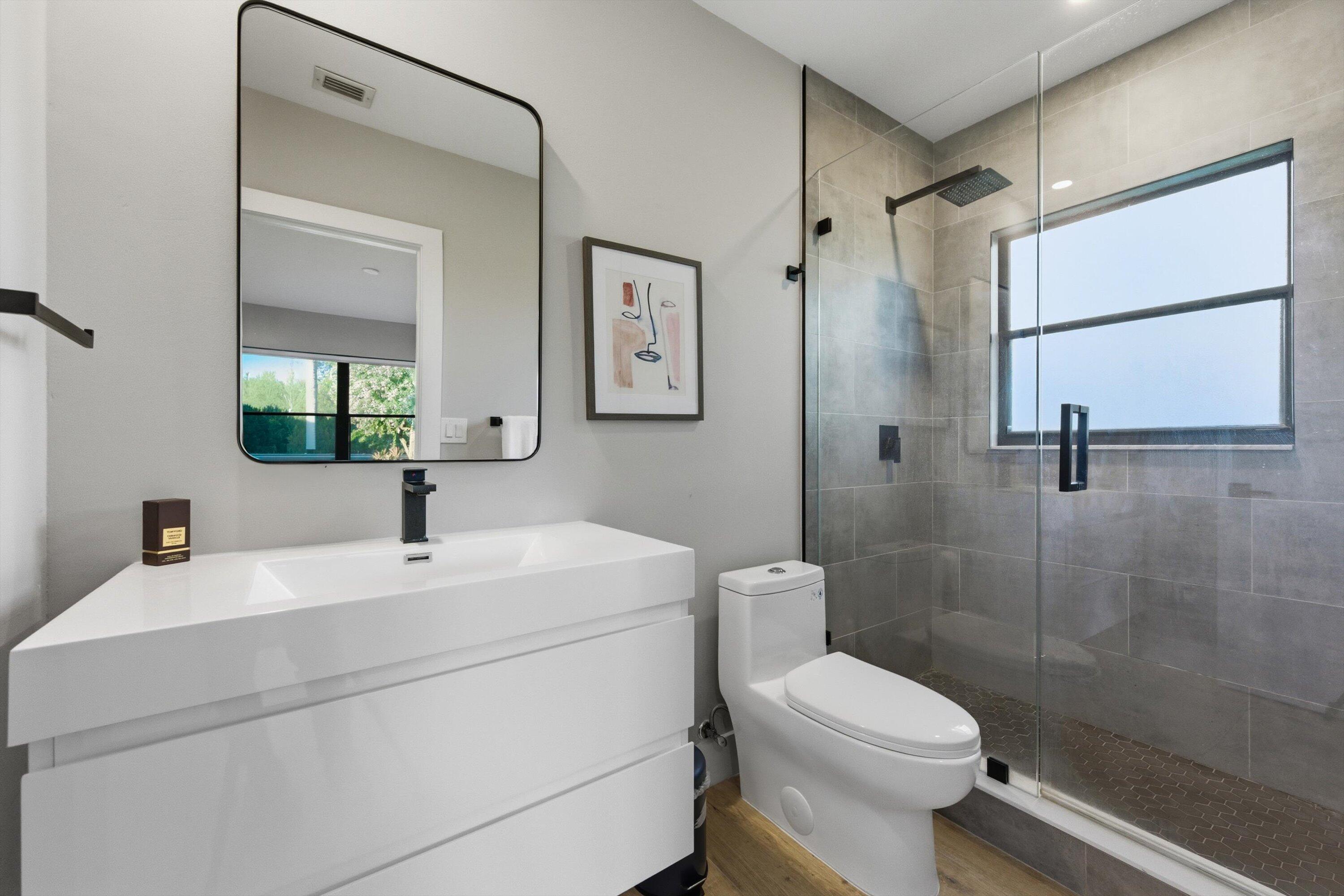 13224 Polo Club Road, Unit A204 Wellington, FL 33414 - Photo 20 of 27 a bathroom with a sink toilet and shower