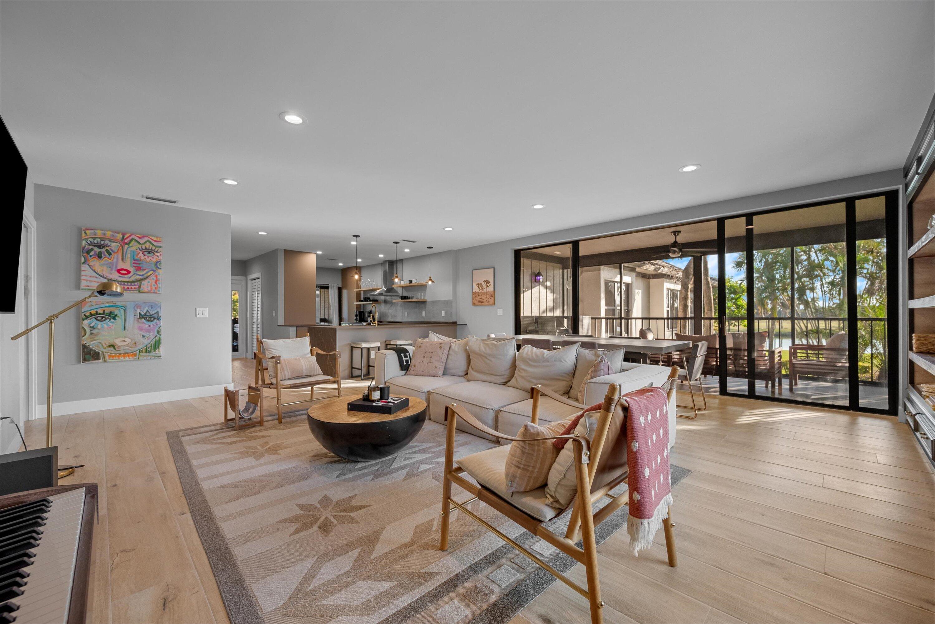 13224 Polo Club Road, Unit A204 Wellington, FL 33414 - Photo 2 of 27 a living room with furniture and a large window