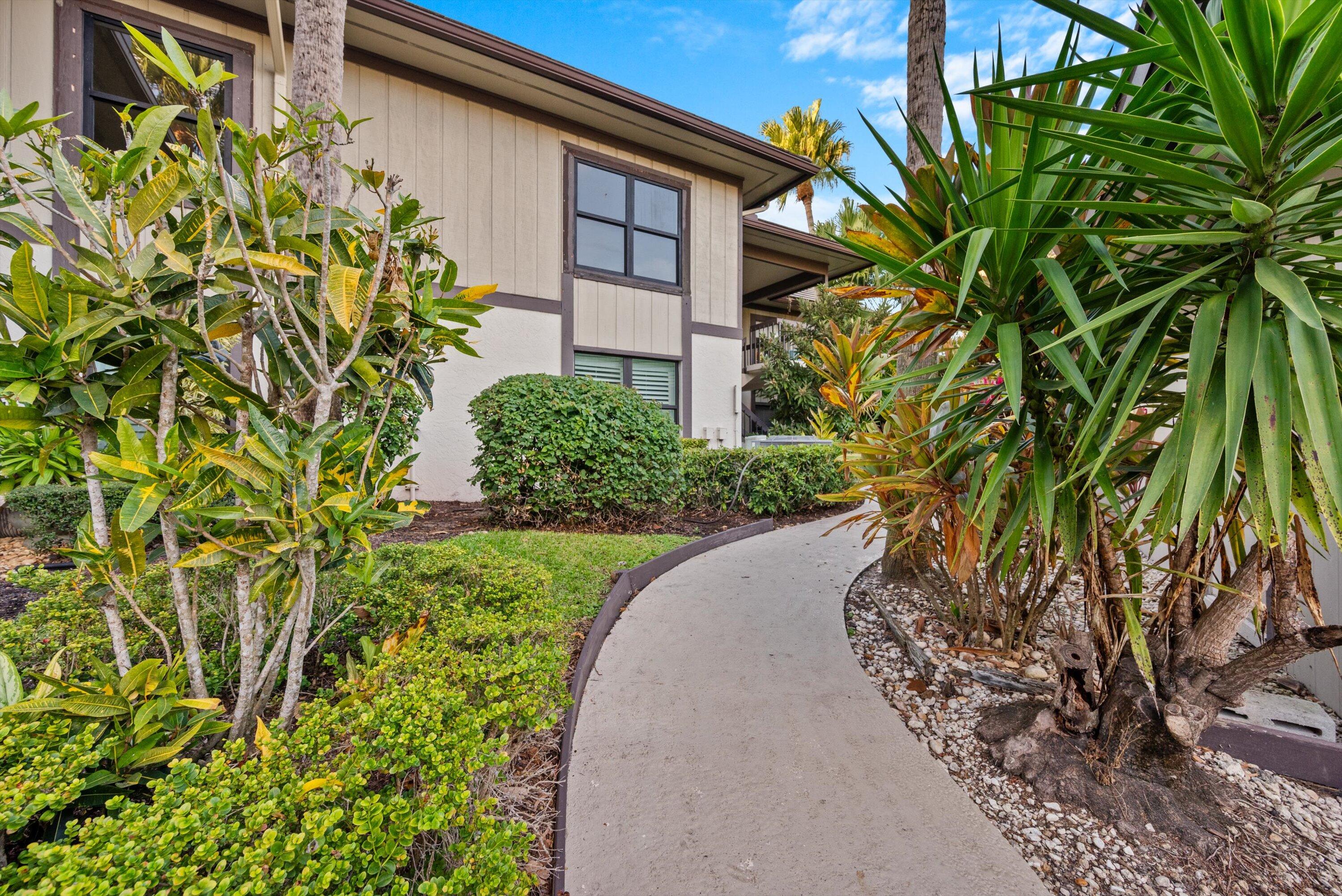 13224 Polo Club Road, Unit A204 Wellington, FL 33414 - Photo 24 of 27 a view of a garden with plants