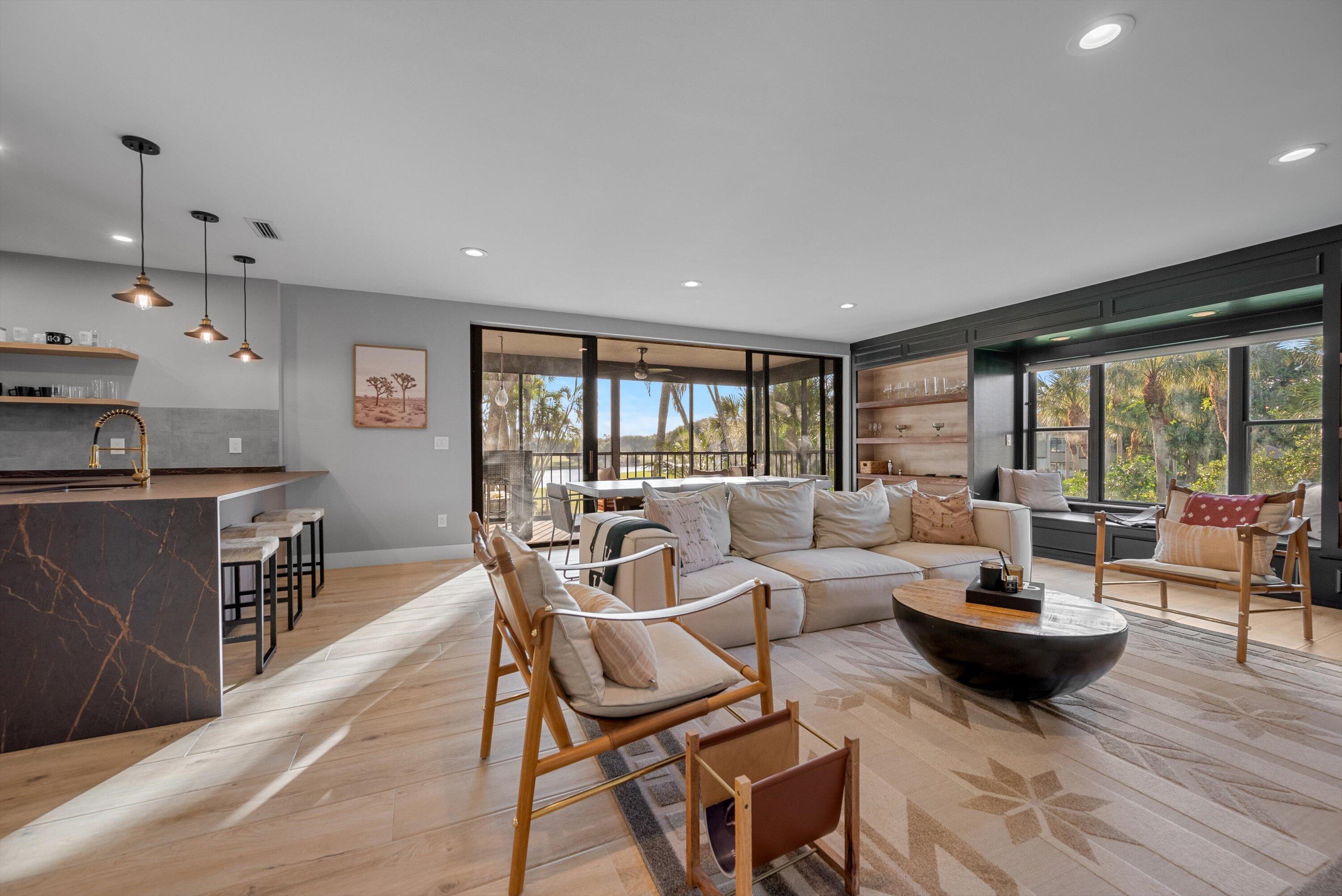 13224 Polo Club Road, Unit A204 Wellington, FL 33414 - Photo 3 of 27 a living room with furniture and a large window