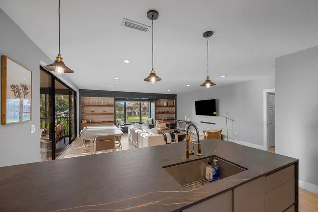 a view of a kitchen with a sink and dishwasher