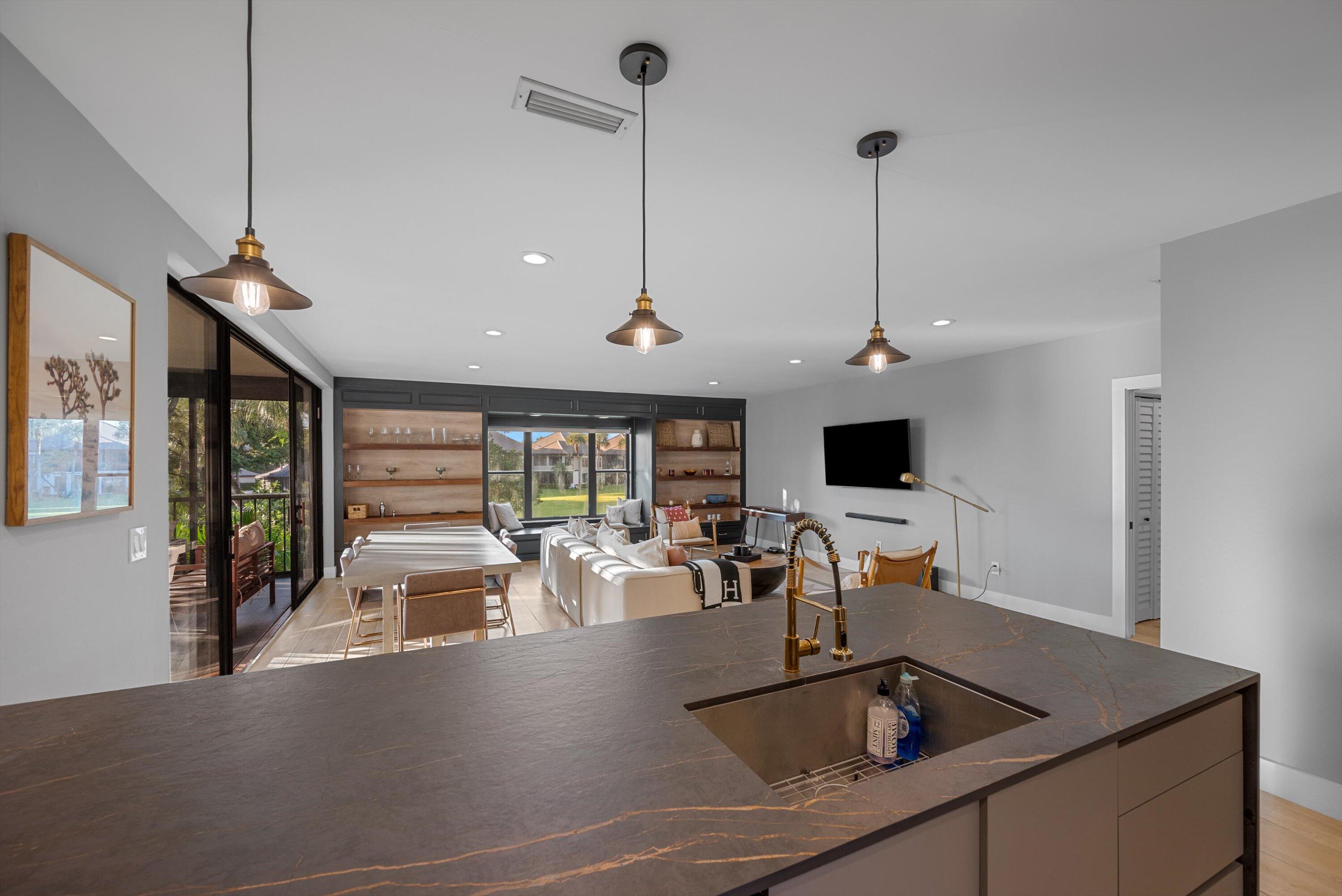 13224 Polo Club Road, Unit A204 Wellington, FL 33414 - Photo 7 of 27 a view of a kitchen with a sink and dishwasher
